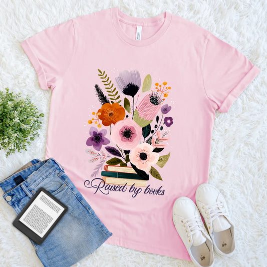 Pink cozy vintage reader shirt with blooming flowers and book stack art 