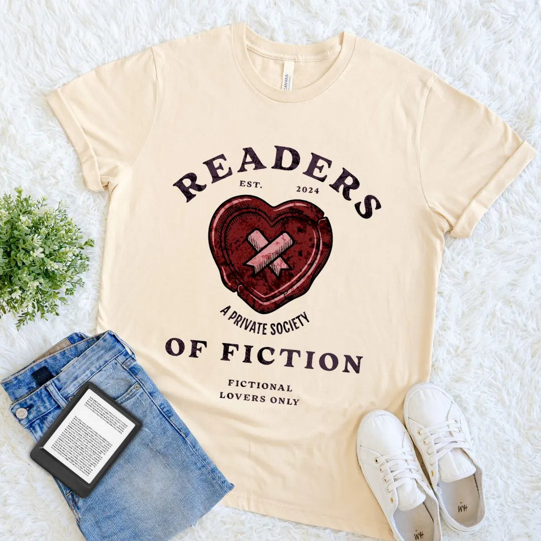 Soft cotton cream Vintage-style “Readers of Fiction” tee with heart graphic and private society design