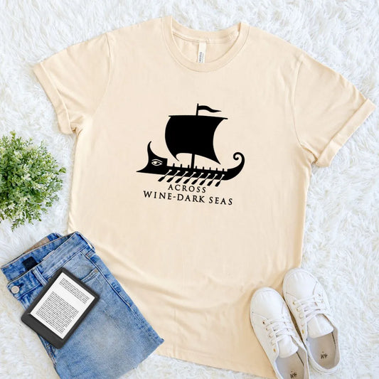Cream book lover T-shirt featuring an ancient Greek trireme and Across Wine-Dark Seas quote 
