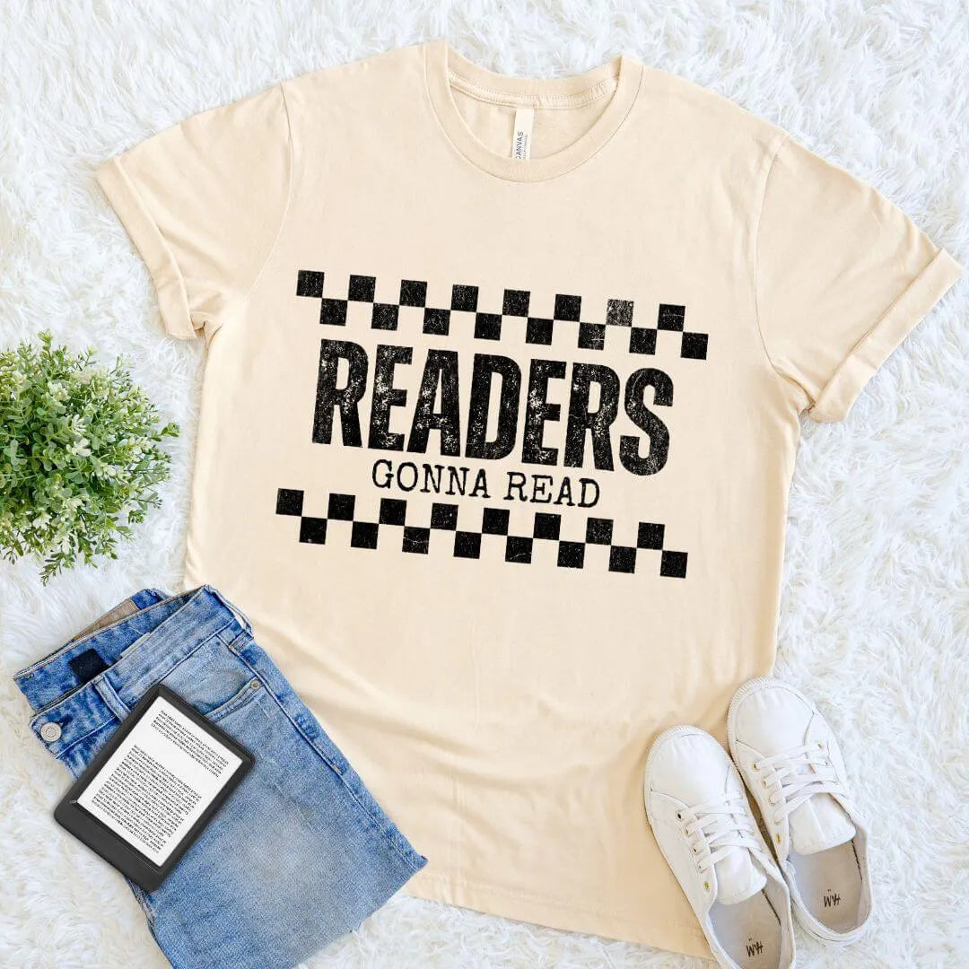 Flat lay of cream soft cotton shirt with   "readers gonna read" text  and vintage distressed checkerboard   design 