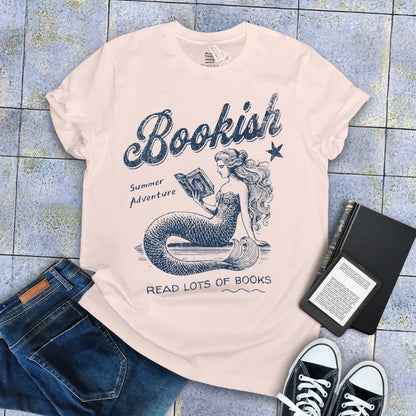 whimsical vintage tee with mermaid and books