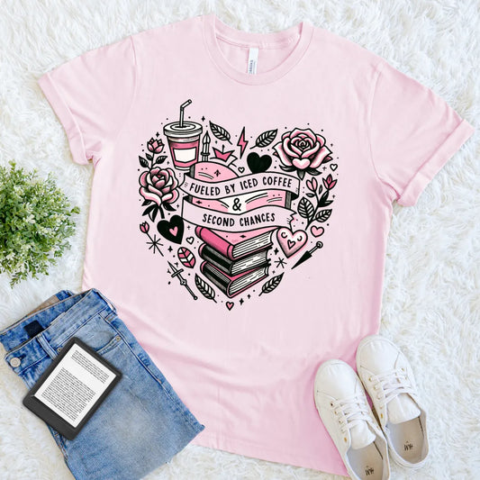 Pink romantic reader tee with iced coffee and stack of books