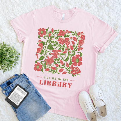 book lover t-shirt with  vintage aesthetic design and text "I'll be in my library", soft pink introvert reading shirt