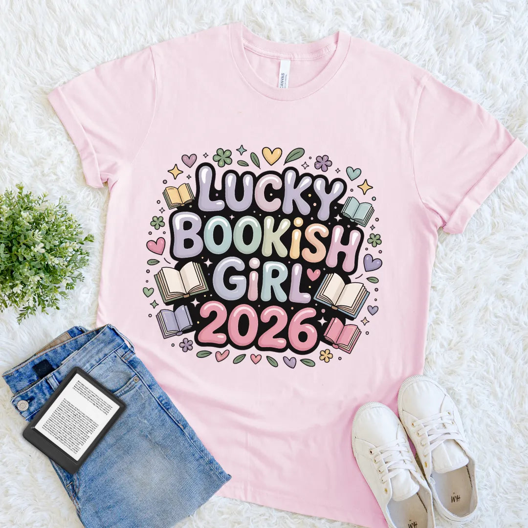 Soft pink 100%cotton Book lover aesthetic tee styled with jeans, white shoes, and an e-reader