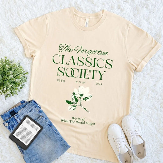 Soft cream cotton  T-shirt with dark academia quote “The Forgotten Classics Society” in green serif text and floral element  