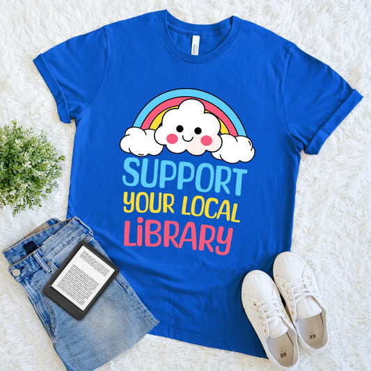 Royal blue colorful T-shirt with rainbow and “Support Your Local Library” quote