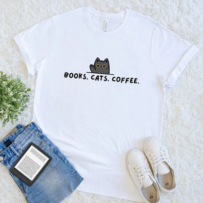 White minimalist reader tee featuring cute black cat and text "books. cats. coffee"