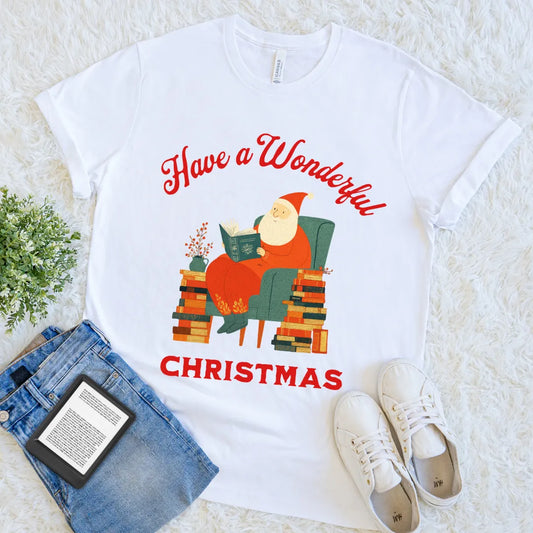 White tee with festive “Have a Wonderful Christmas” text and cozy Santa reading a book