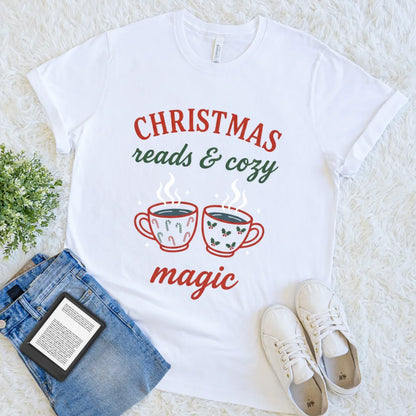 White T-shirt with festive mugs and text “Christmas Reads & Cozy Magic”