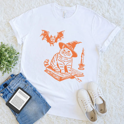witchy reading shirt featuring cat on spell book