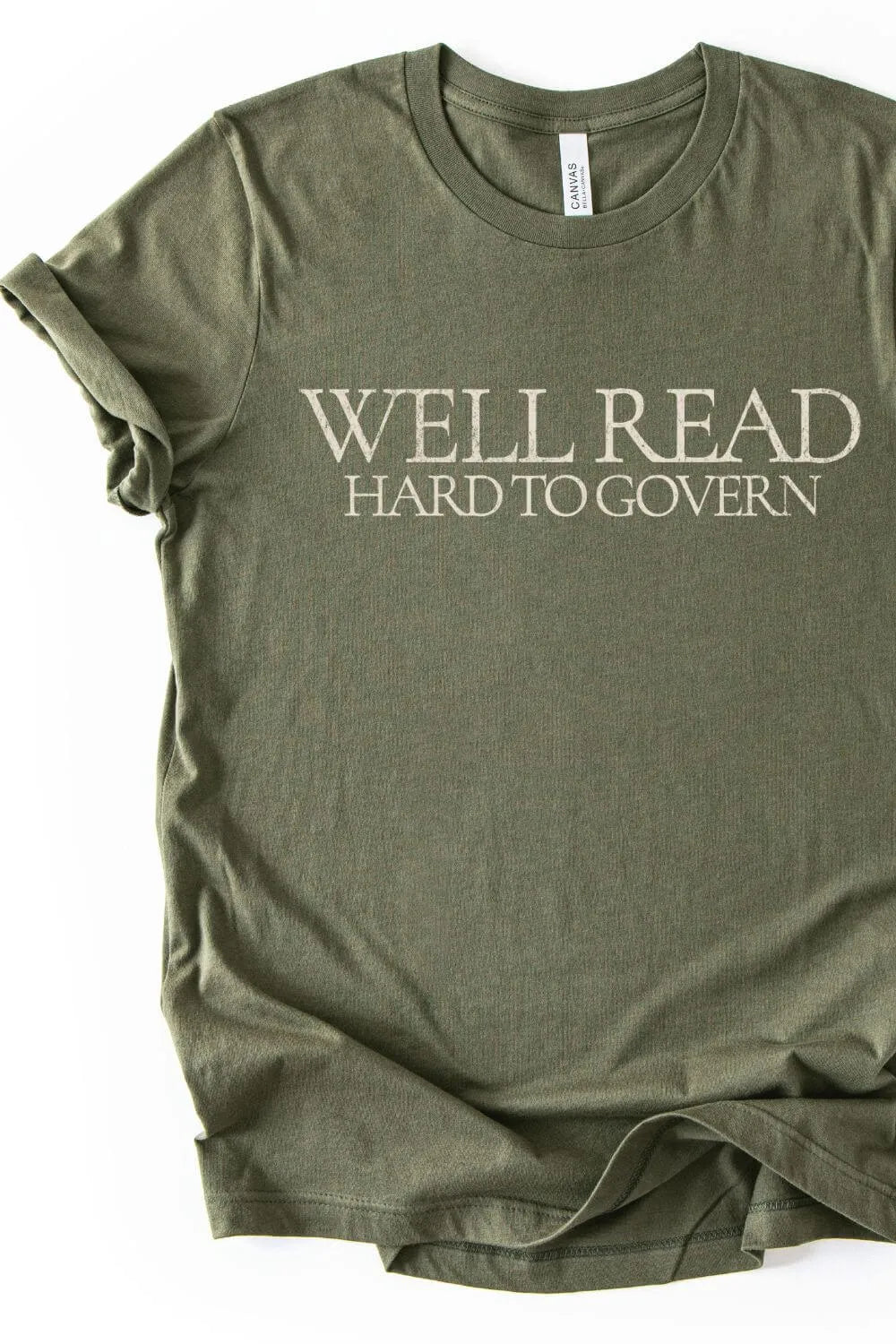 Reader t-shirt in olive green with 'Well Read Hard to Govern' text on a white background