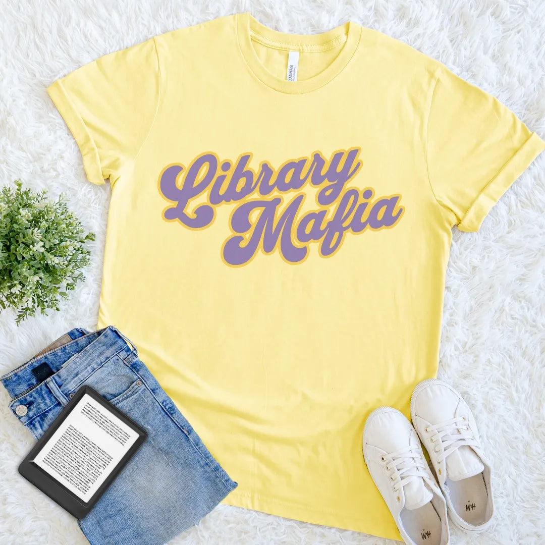 Yellow Library Mafia graphic shirt turning fierce library devotion into cheerful reader humor