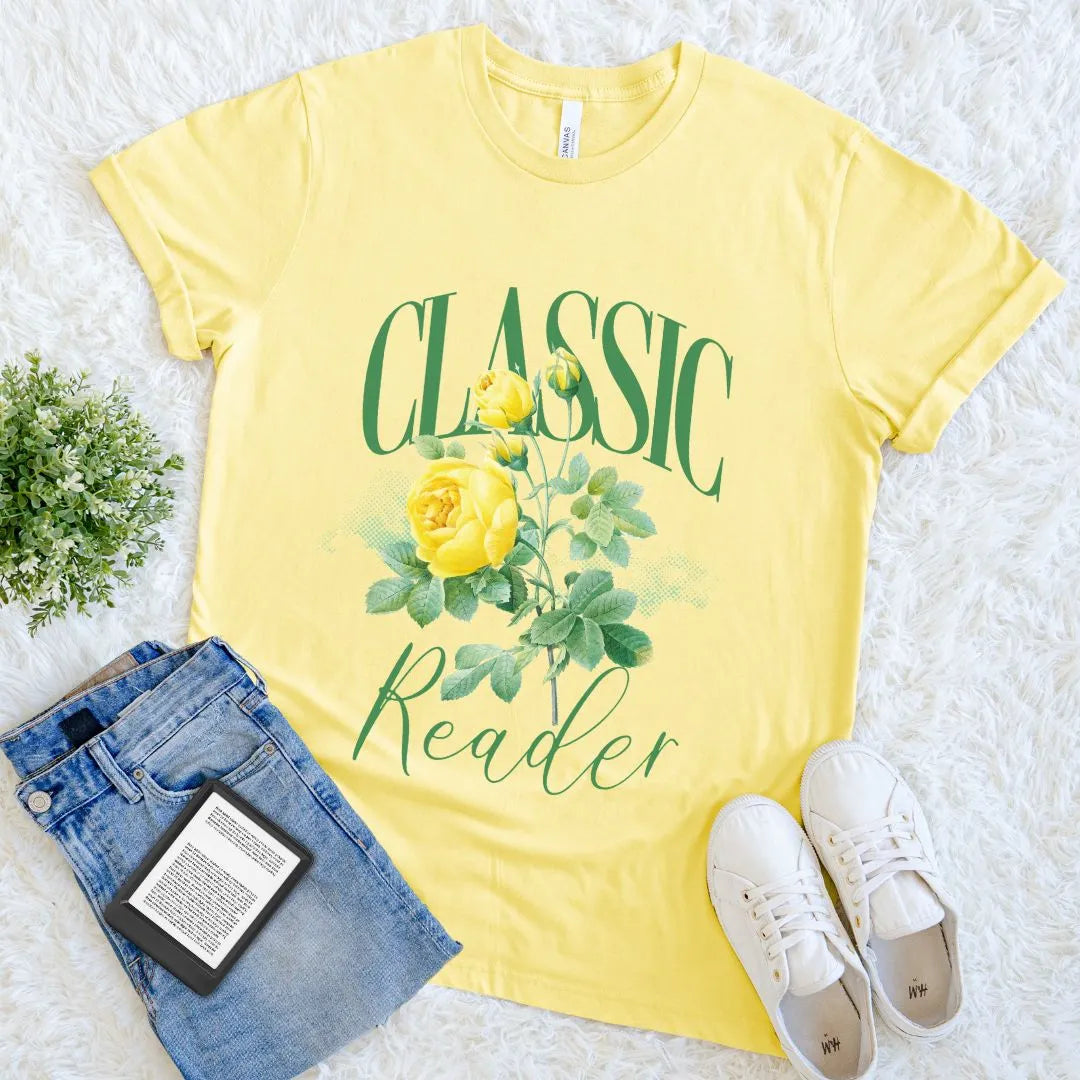 Bright yellow  bookish T-shirt with vintage  rose illustration and classic reader text in green typography