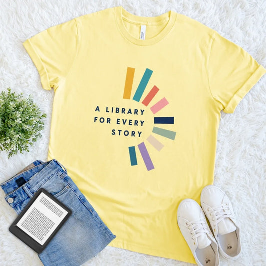 Yellow A Library for Every Story reader T-shirt with colorful book-inspired shapes and a minimalist library quote, a cheerful bookish graphic tee for devoted readers.