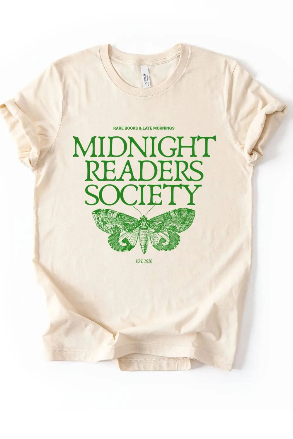 flat lay of cream soft cotton t-shirt   with green moth design and "midnight readers society" text on white background
