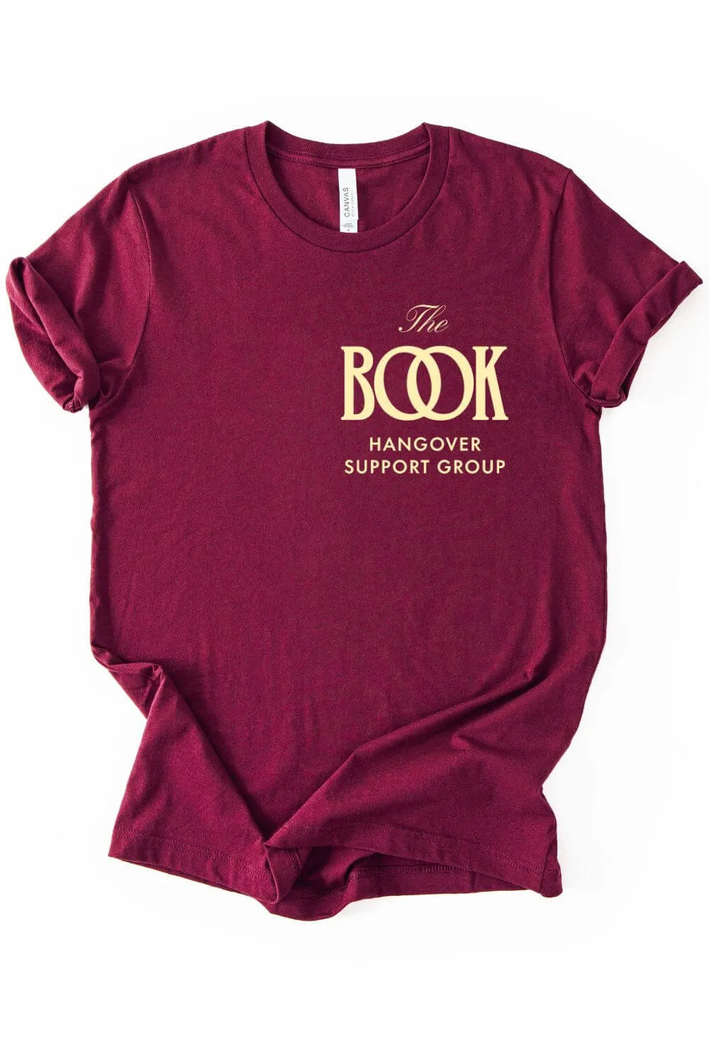 Soft cotton maroon red minimalist graphic t-shirt with gold logo  reading “The Book Hangover Support Group”