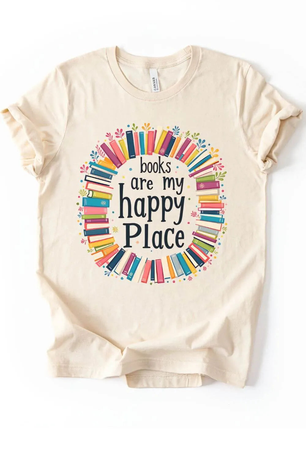 Soft cotton natural beige graphic t-shirt with colorful illustrated books forming a wreath around the text “Books Are My Happy Place.”