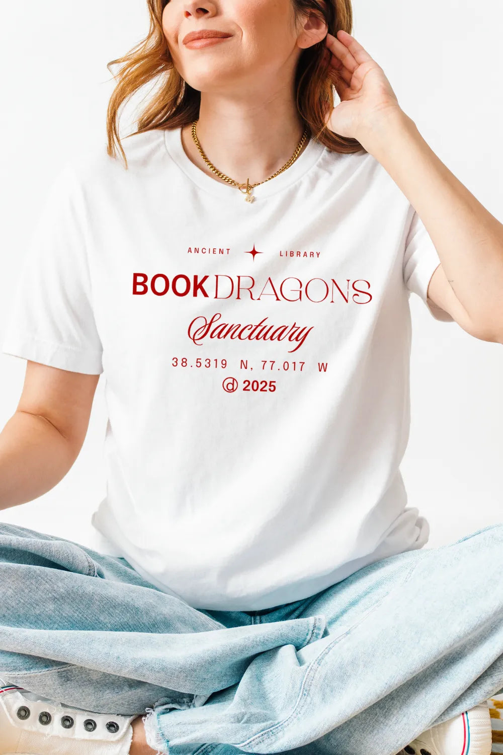 girl wearing white literary t-shirt for book lovers with minimalist design  and  text Book Dragons Sanctuary