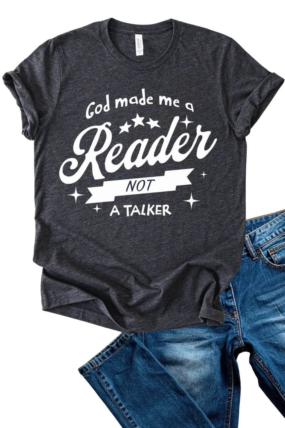 Dark heather gray graphic t-shirt with white text reading “God Made Me a Reader, Not a Talker” in a bold, playful bookish style.