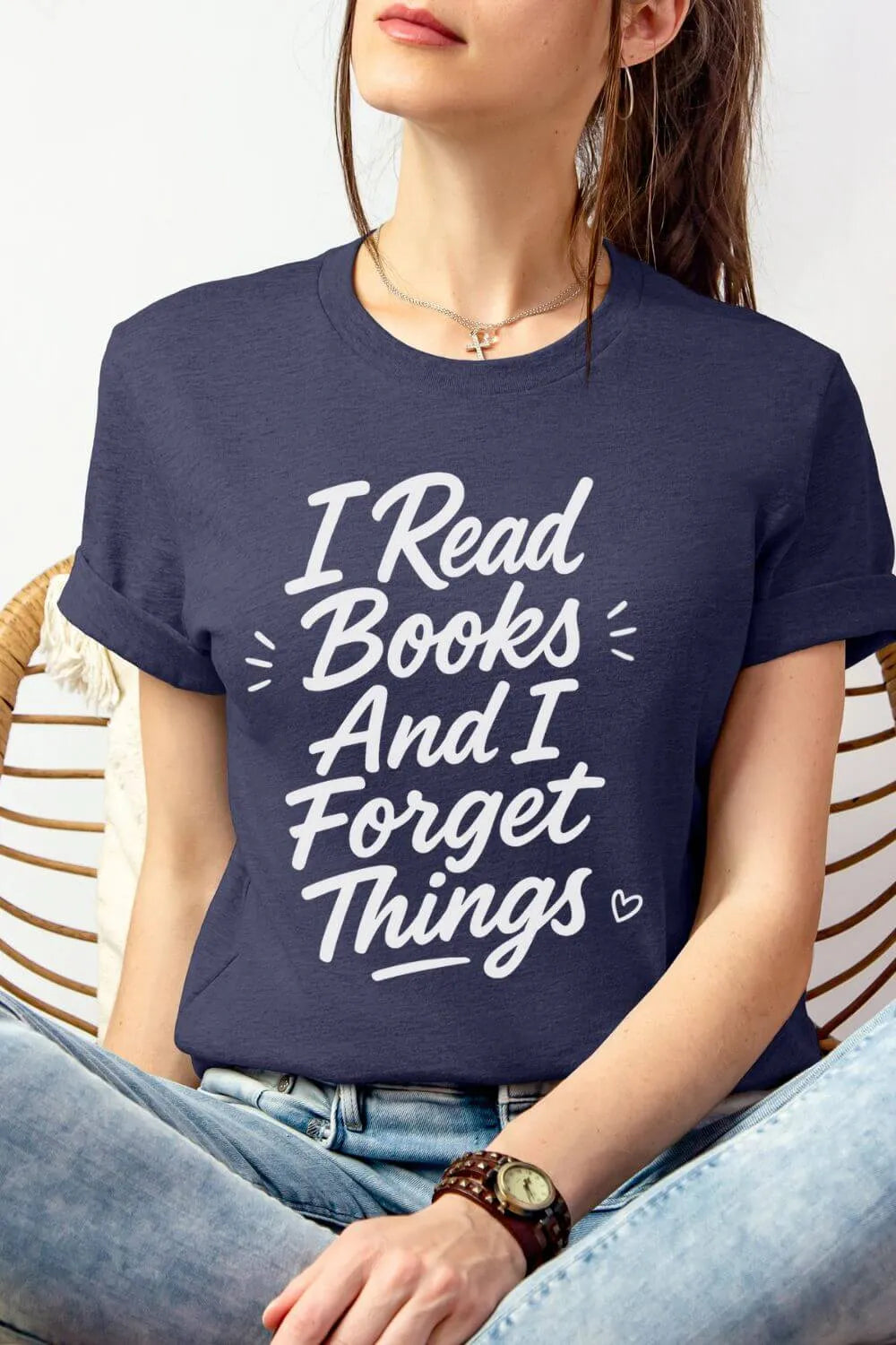 woman wearing a heather navy reading t-shirt with funny bookish quote "I read books and I forget things" styled with denim